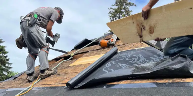 Commercial roof mid-replacement with new material being installed