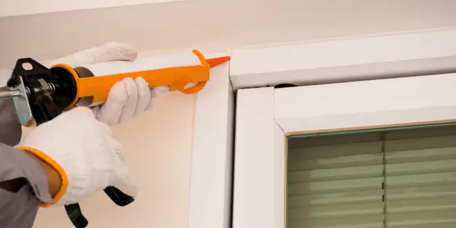 Exterior caulking applied around a roofline feature