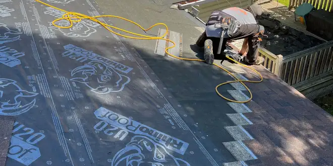 Asphalt shingle roof section after a repair visit